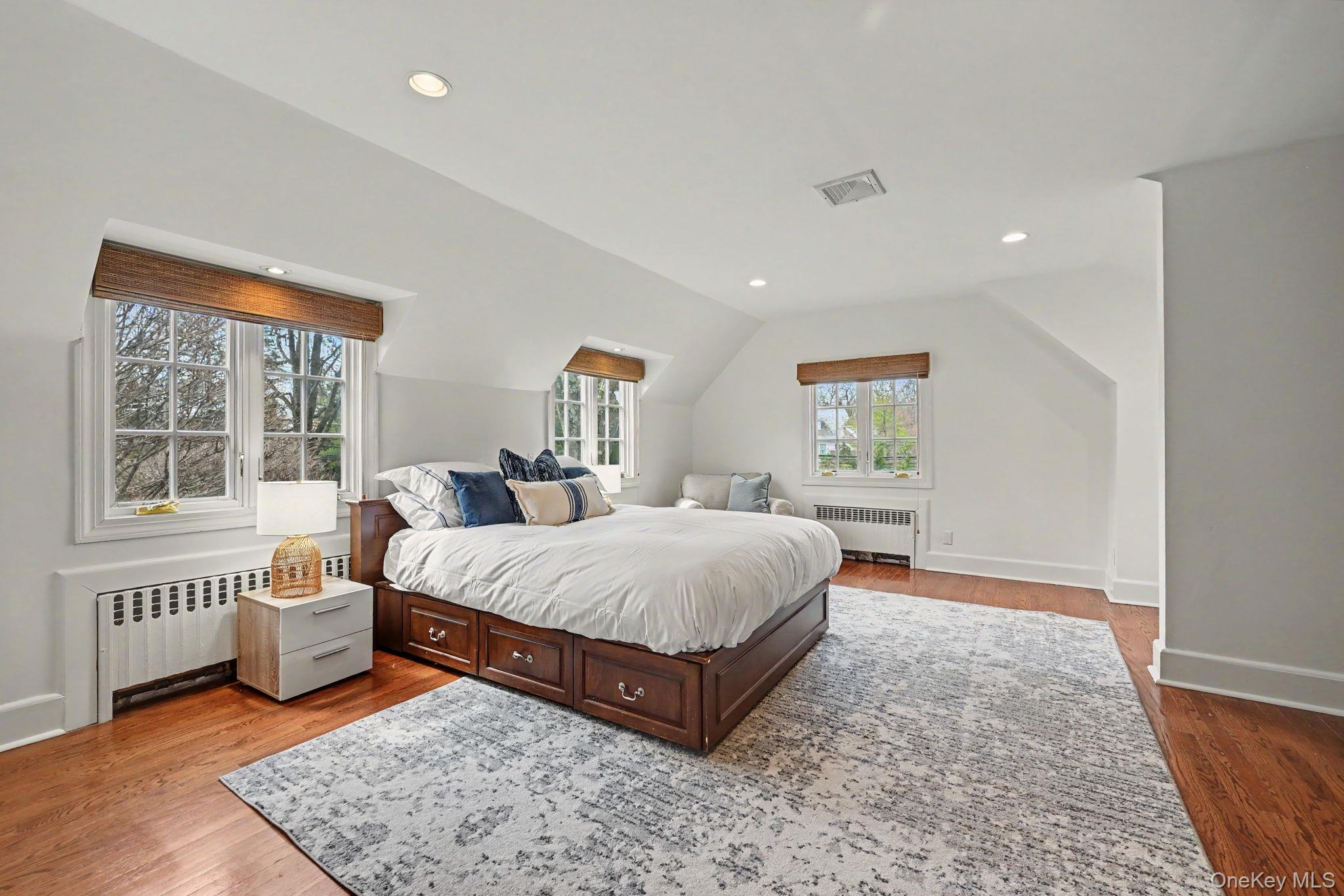 2 Park Drive South Rye, NY 10580 - Photo 37 of 50 a spacious bedroom with a bed and a window