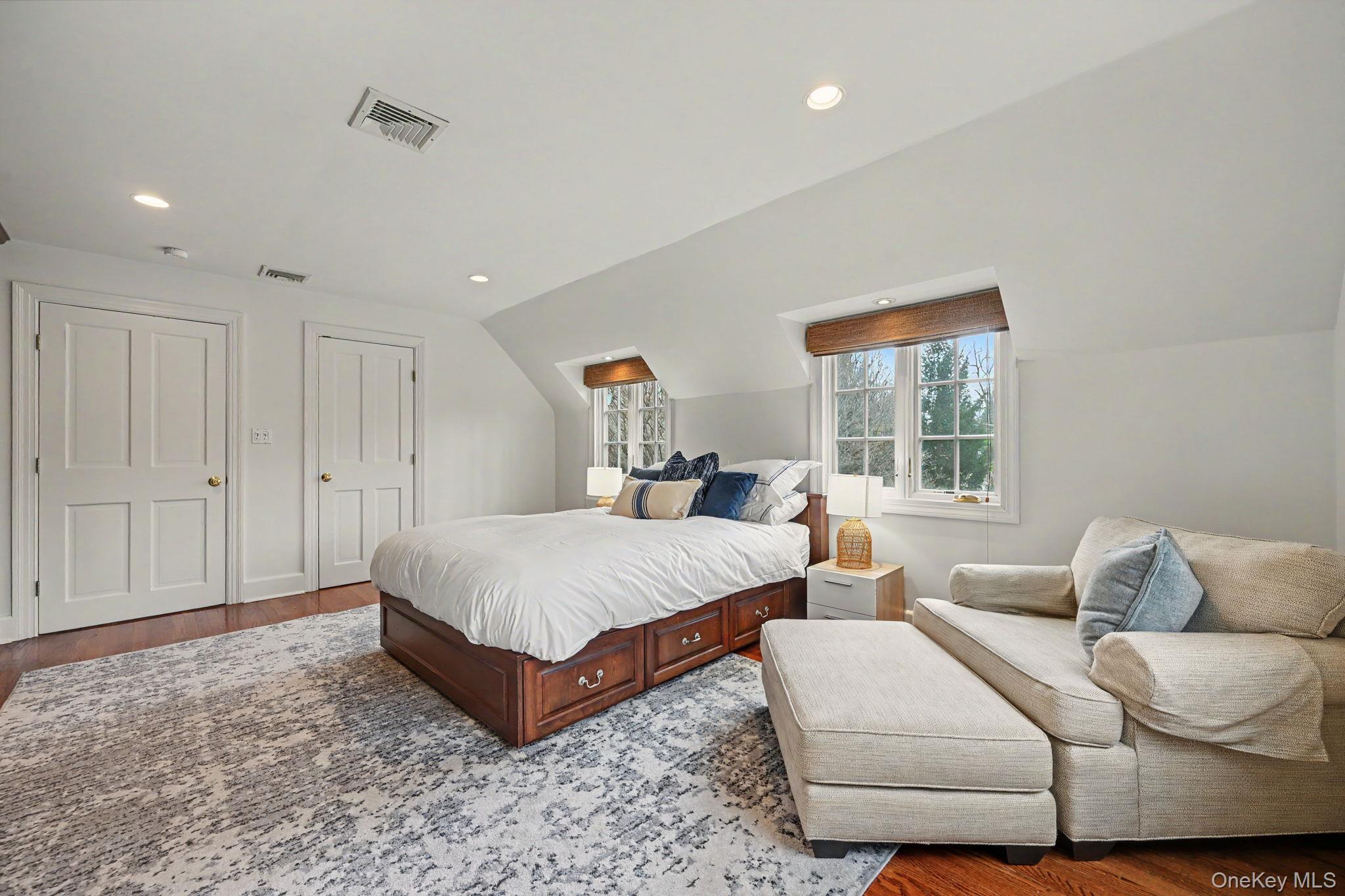 2 Park Drive South Rye, NY 10580 - Photo 38 of 50 a spacious bedroom with a bed and a window
