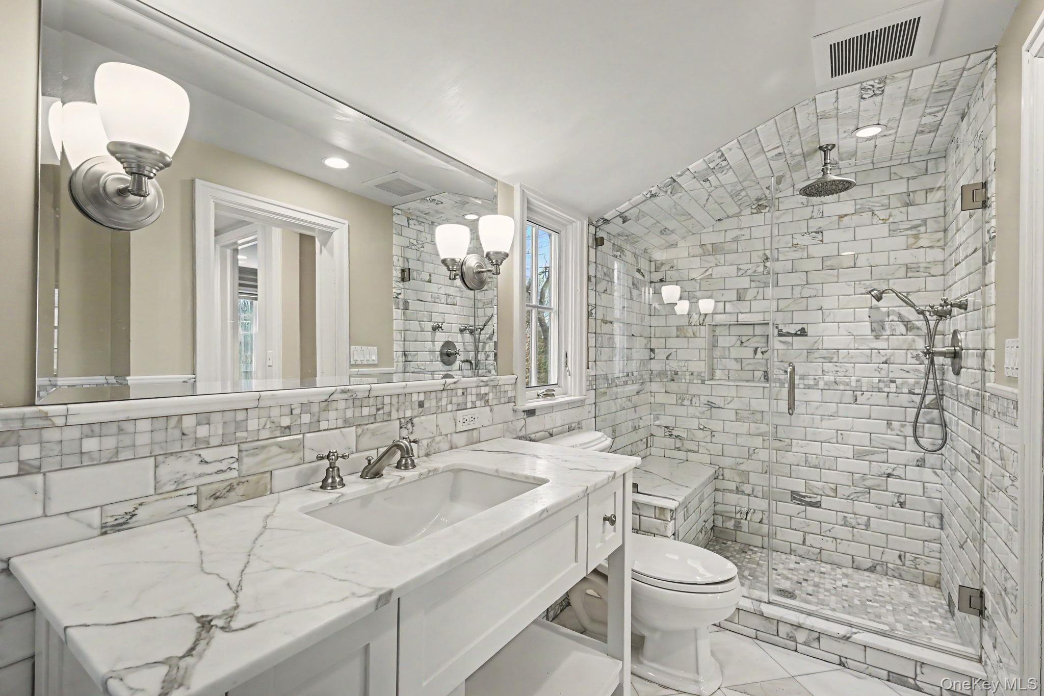 2 Park Drive South Rye, NY 10580 - Photo 39 of 50 a bathroom with a sink a toilet and shower