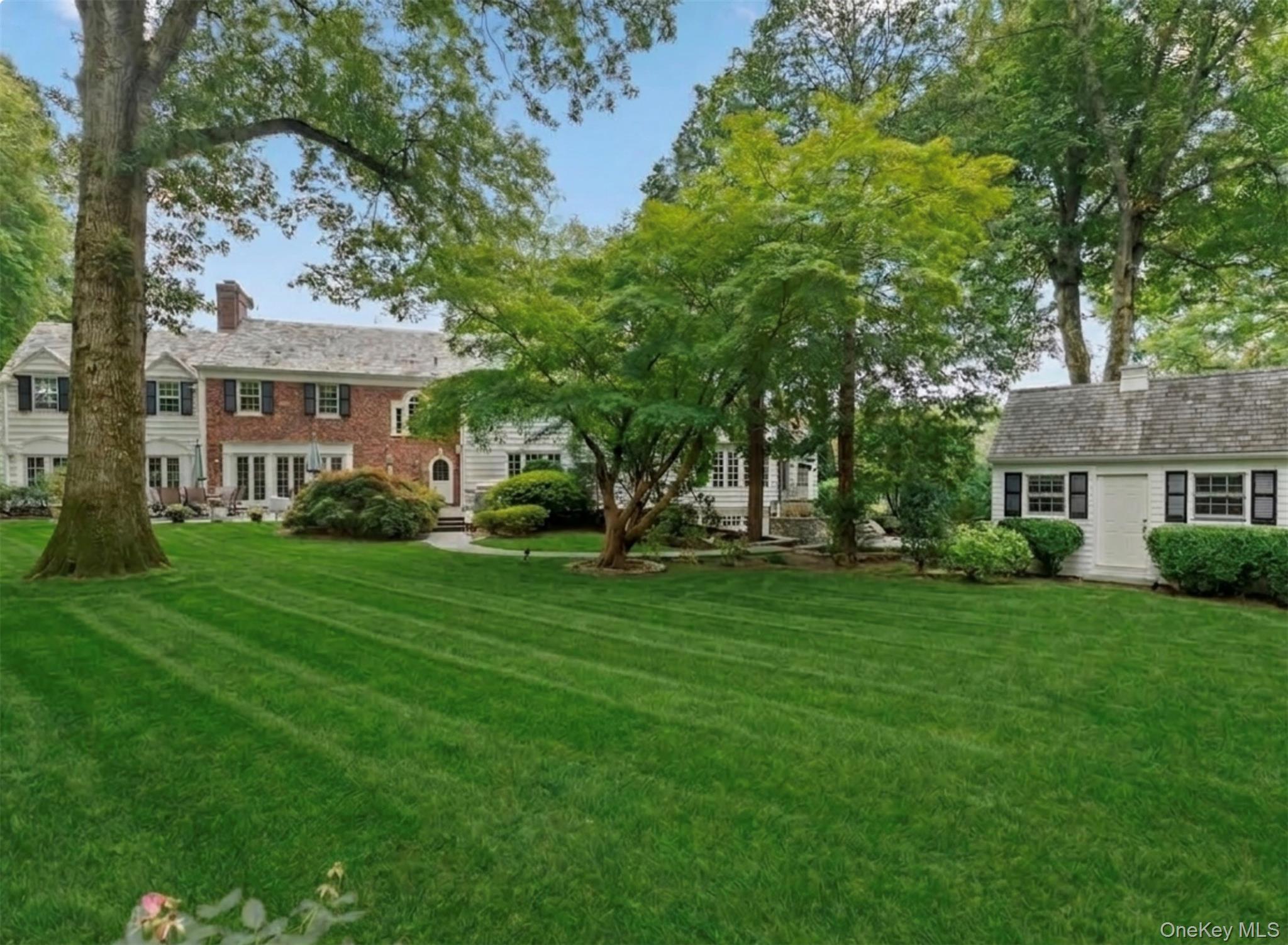 2 Park Drive South Rye, NY 10580 - Photo 46 of 50 a front view of a house with a garden