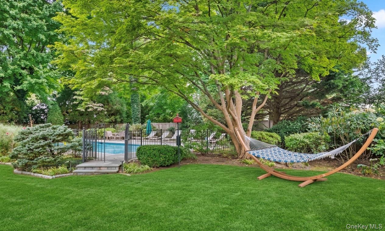 2 Park Drive South Rye, NY 10580 - Photo 5 of 6 Expansive backyard featuring mature Japanese maple trees and gated sparkling pool.Virtually enhanced grass.