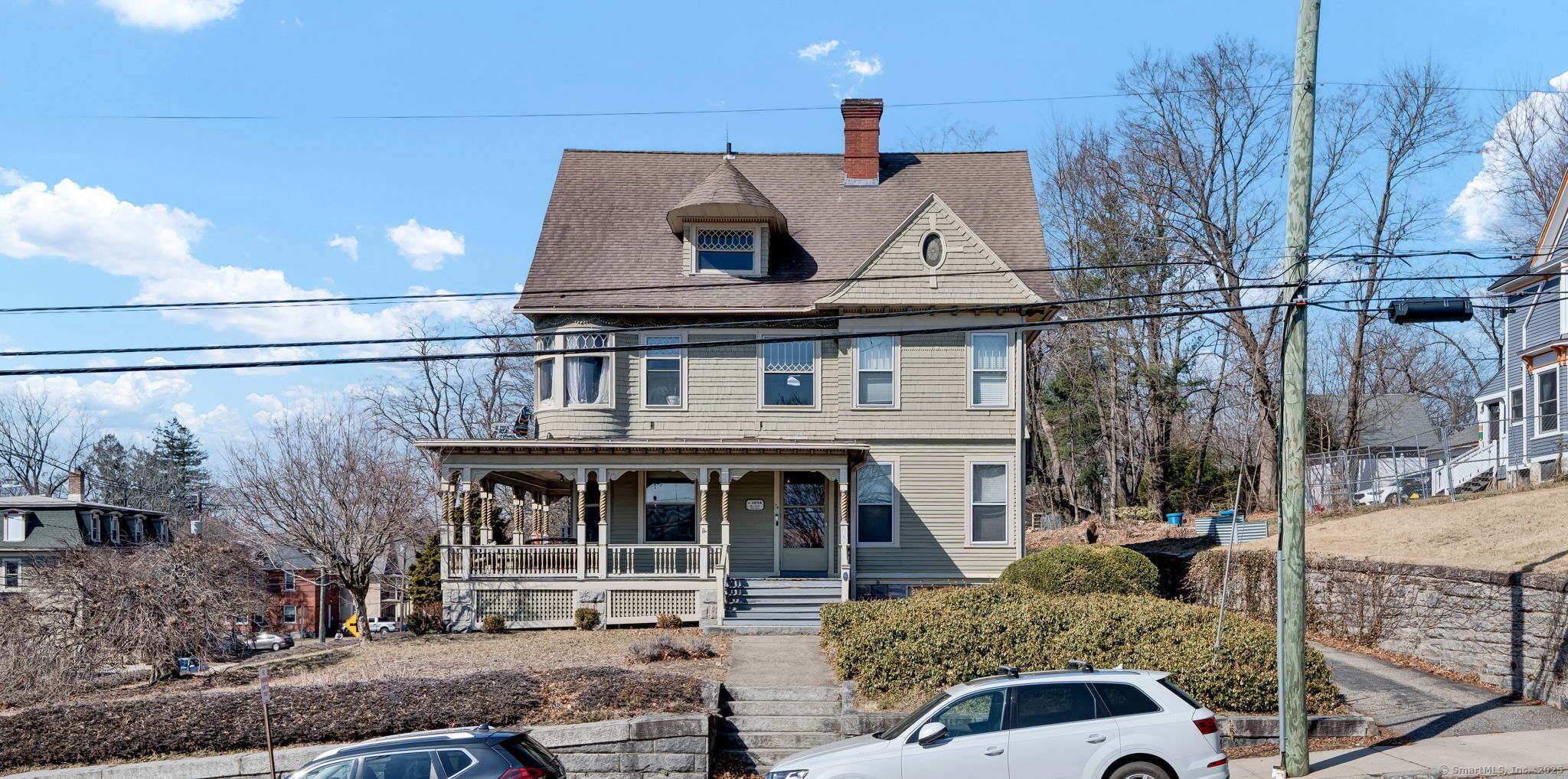 74 Windham Street Windham, CT 06226 - Photo 1 of 1 a front view of a house with garden
