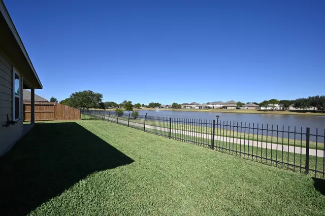 a view of a lake with a big yard