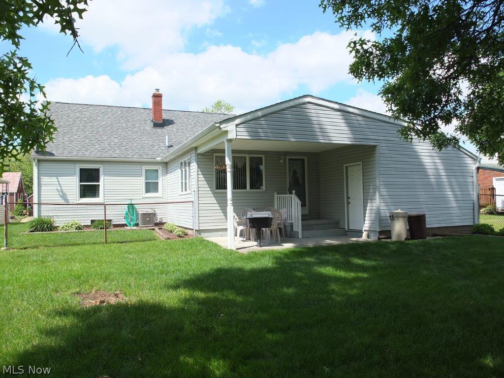3014 Helen Place Northwest Canton, OH 44708 - Photo 13 of 16 Rear exterior and covered patio with built in gas grill.