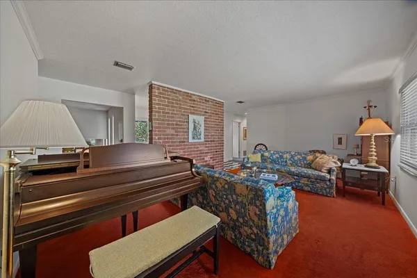 a bedroom with bed and a couch