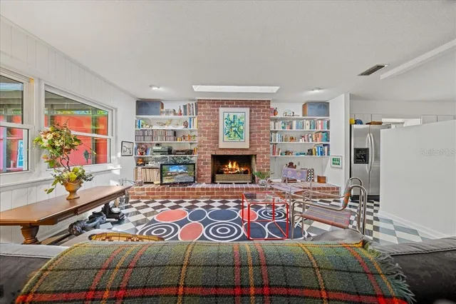 an aerial view of a house with yard swimming pool and outdoor seating