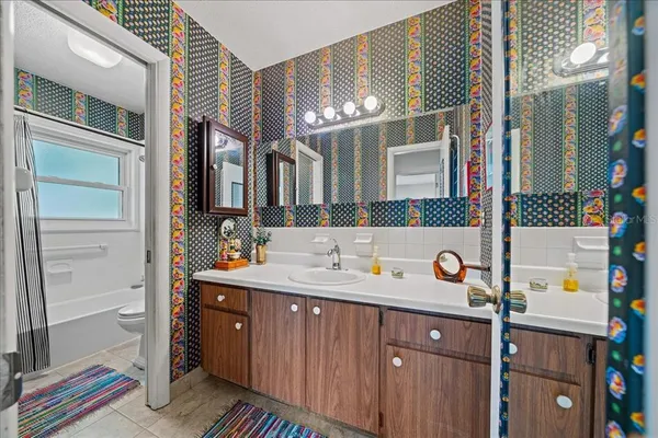 a bedroom with furniture and a bed