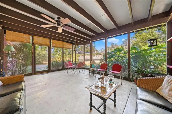 an aerial view of a house with a yard basket ball court and outdoor seating
