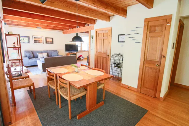 a dining room with a table and chairs