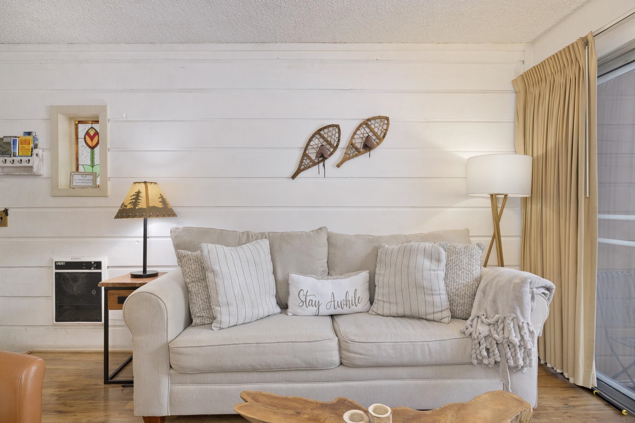 2499 Sierra Nevada Road, Unit R2 Mammoth Lakes, CA 93546 - Photo 11 of 26 a living room with a couch and a table