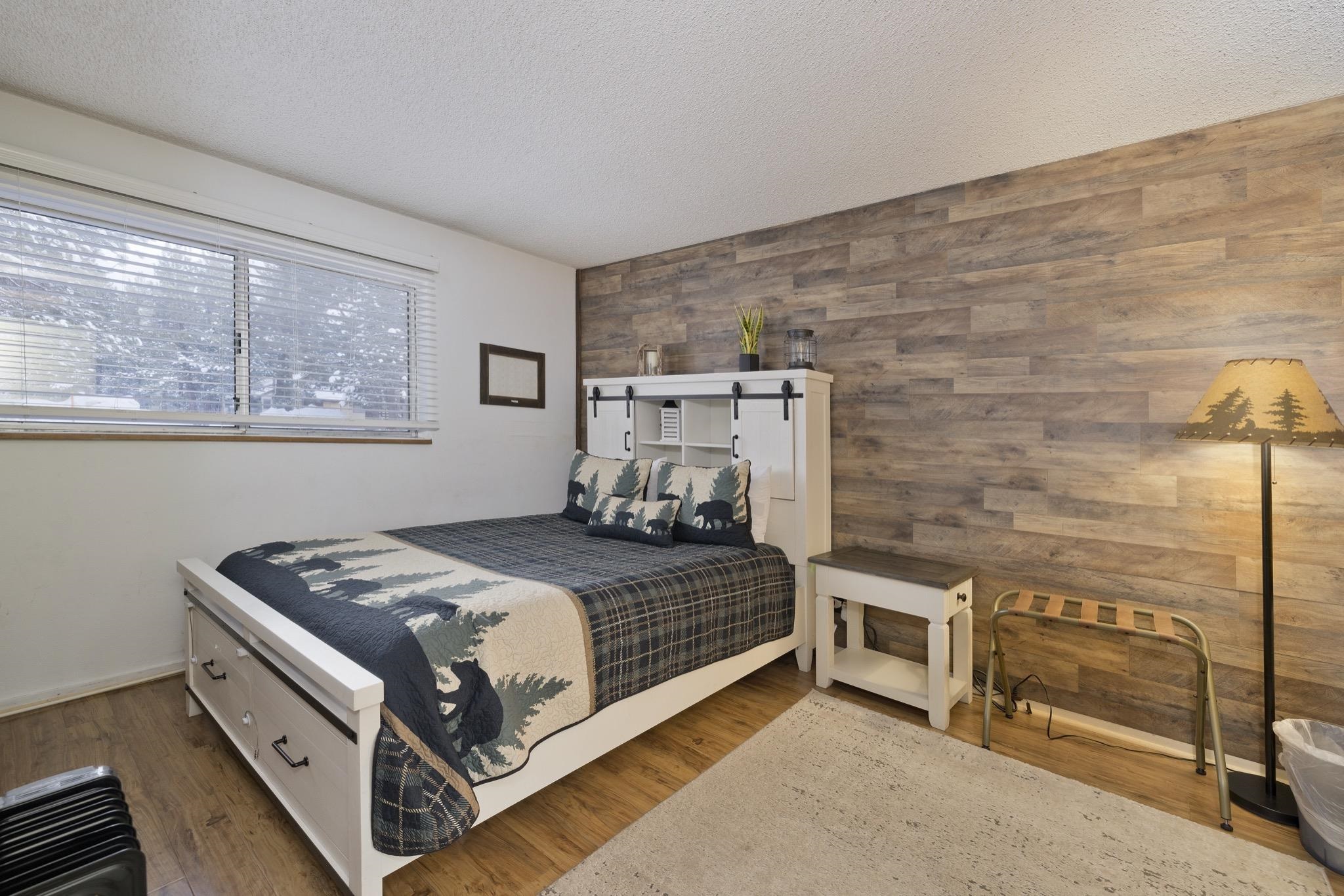 2499 Sierra Nevada Road, Unit R2 Mammoth Lakes, CA 93546 - Photo 17 of 26 a bed sitting in a bedroom next to a window
