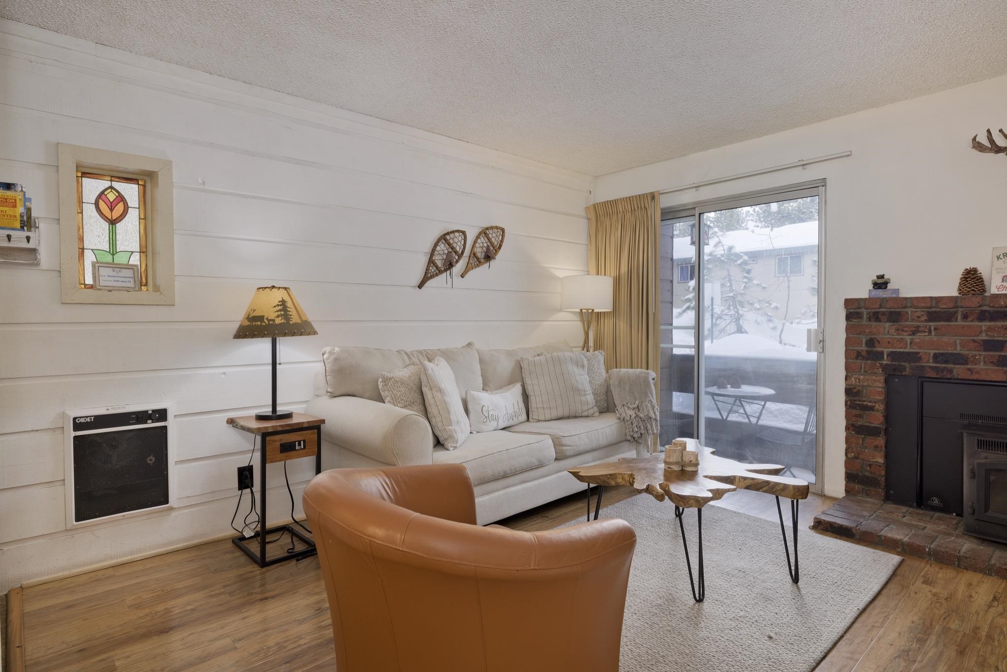 2499 Sierra Nevada Road, Unit R2 Mammoth Lakes, CA 93546 - Photo 9 of 26 a living room with furniture and a fireplace