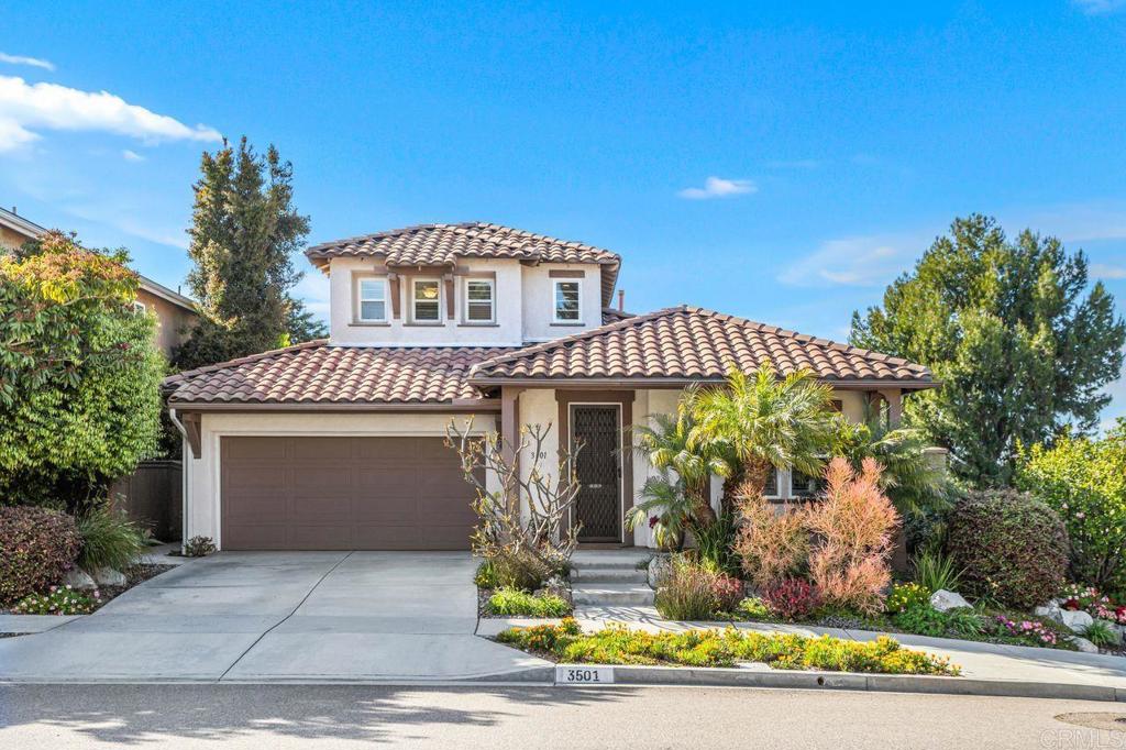 3501 Rock Ridge Road Carlsbad, CA 92010 - Photo 1 of 1 a front view of a house with a garden
