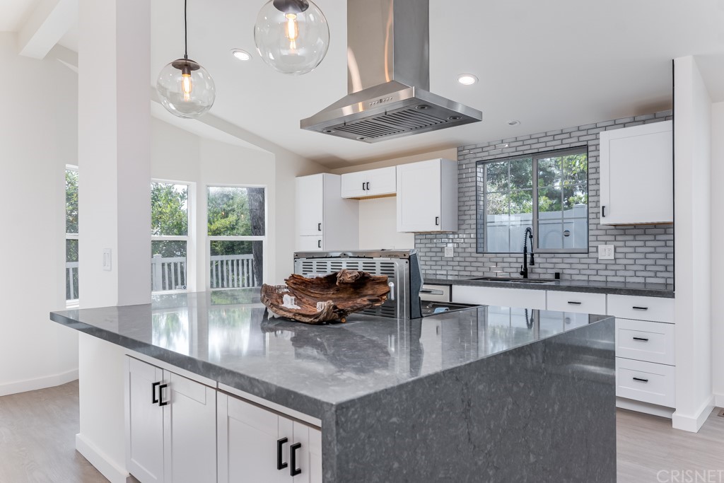 1177 Aztec Topanga, CA 90290 - Photo 12 of 65 a kitchen with granite countertop a sink a counter top space appliances and cabinets