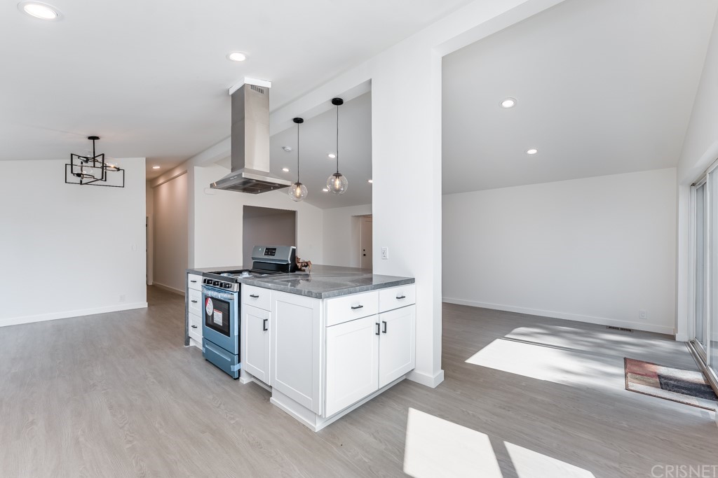 1177 Aztec Topanga, CA 90290 - Photo 18 of 65 a kitchen with stainless steel appliances granite countertop a stove and a sink