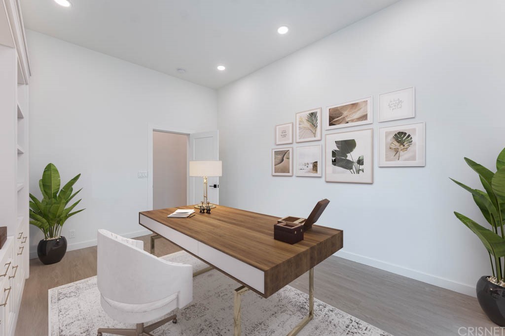 1177 Aztec Topanga, CA 90290 - Photo 32 of 65 a living room with furniture a potted plant and a flat screen tv
