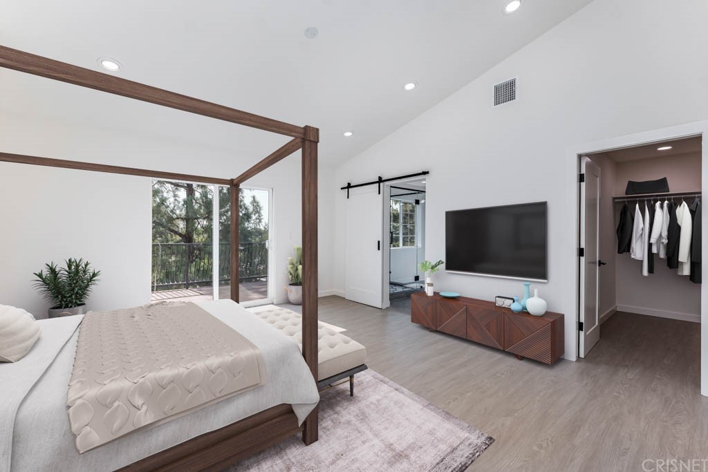 1177 Aztec Topanga, CA 90290 - Photo 35 of 65 a bedroom with a bed and a flat screen tv