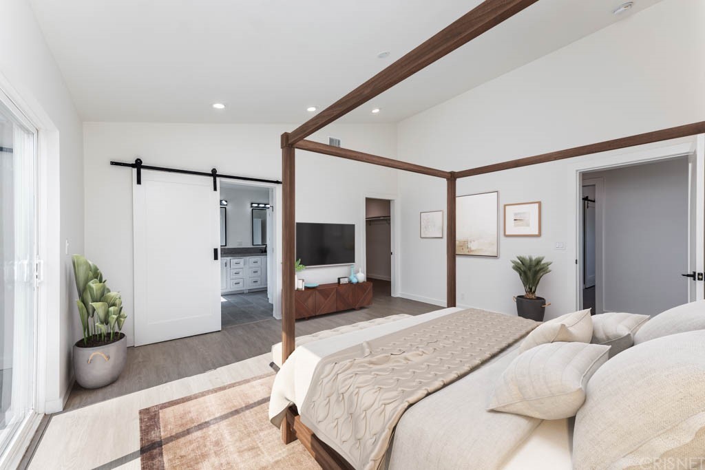 1177 Aztec Topanga, CA 90290 - Photo 37 of 65 a bedroom with a bed and a potted plant