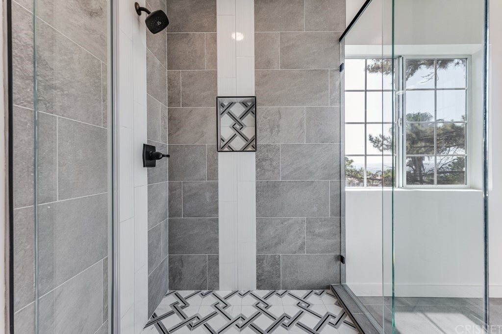 1177 Aztec Topanga, CA 90290 - Photo 40 of 65 a bathroom with a glass shower door