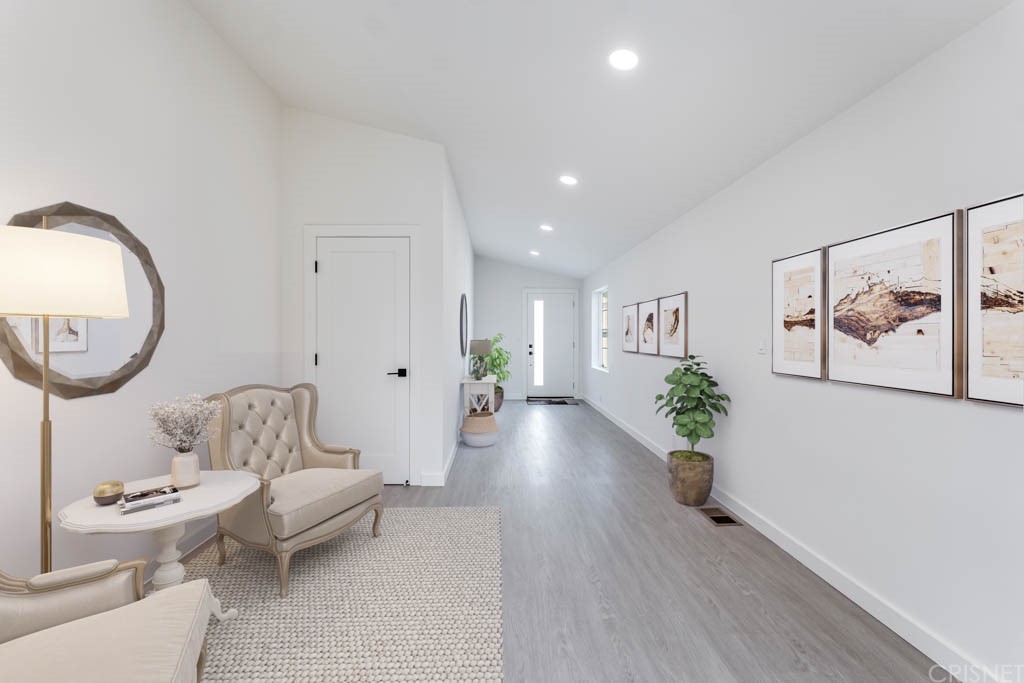 1177 Aztec Topanga, CA 90290 - Photo 4 of 65 a living room with furniture and a wooden floor