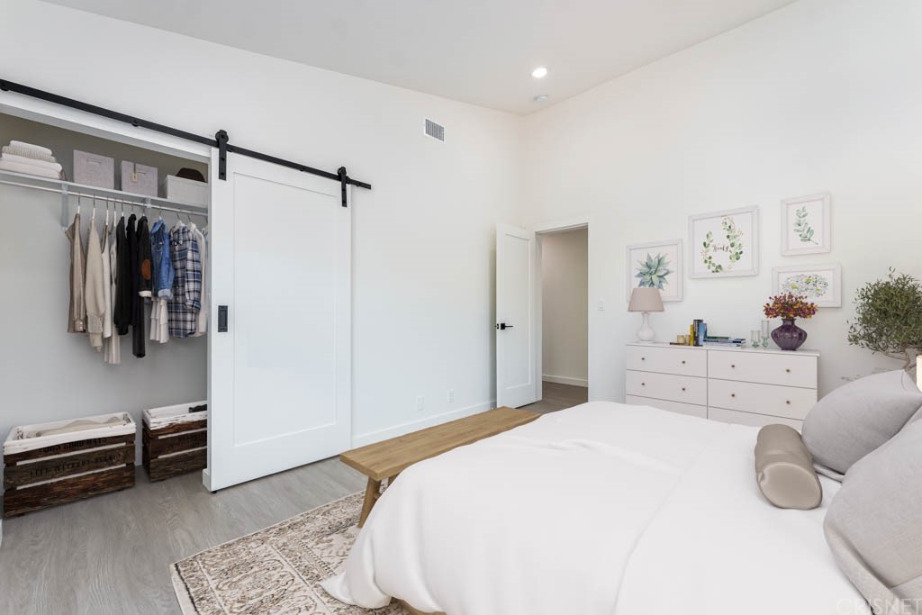 1177 Aztec Topanga, CA 90290 - Photo 47 of 65 a bedroom with a bed and cabinets