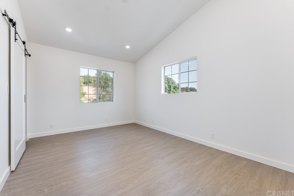 1177 Aztec Topanga, CA 90290 - Photo 51 of 65 an empty room with windows and closet