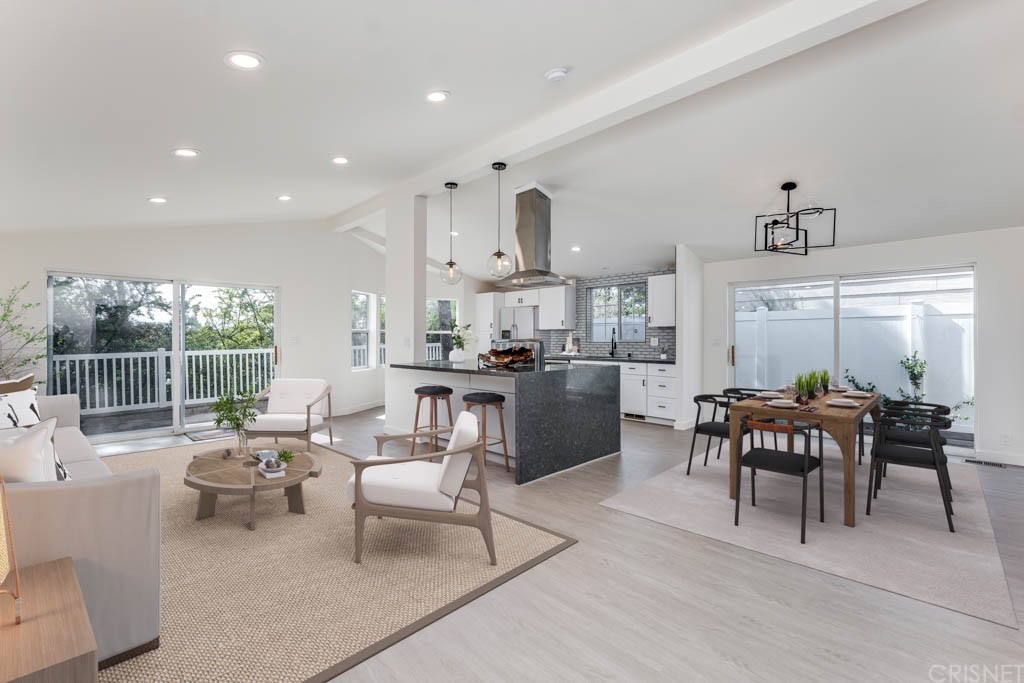 1177 Aztec Topanga, CA 90290 - Photo 7 of 65 a living room with furniture a large window and a table