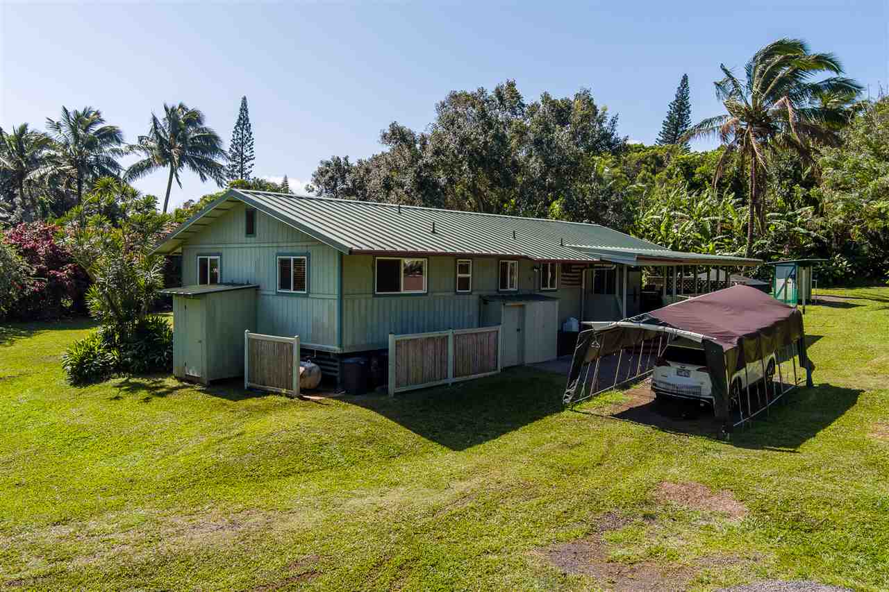 595 Kulike Road Haiku, HI 96708 - Photo 17 of 25 a view of a house with a yard patio and sitting area