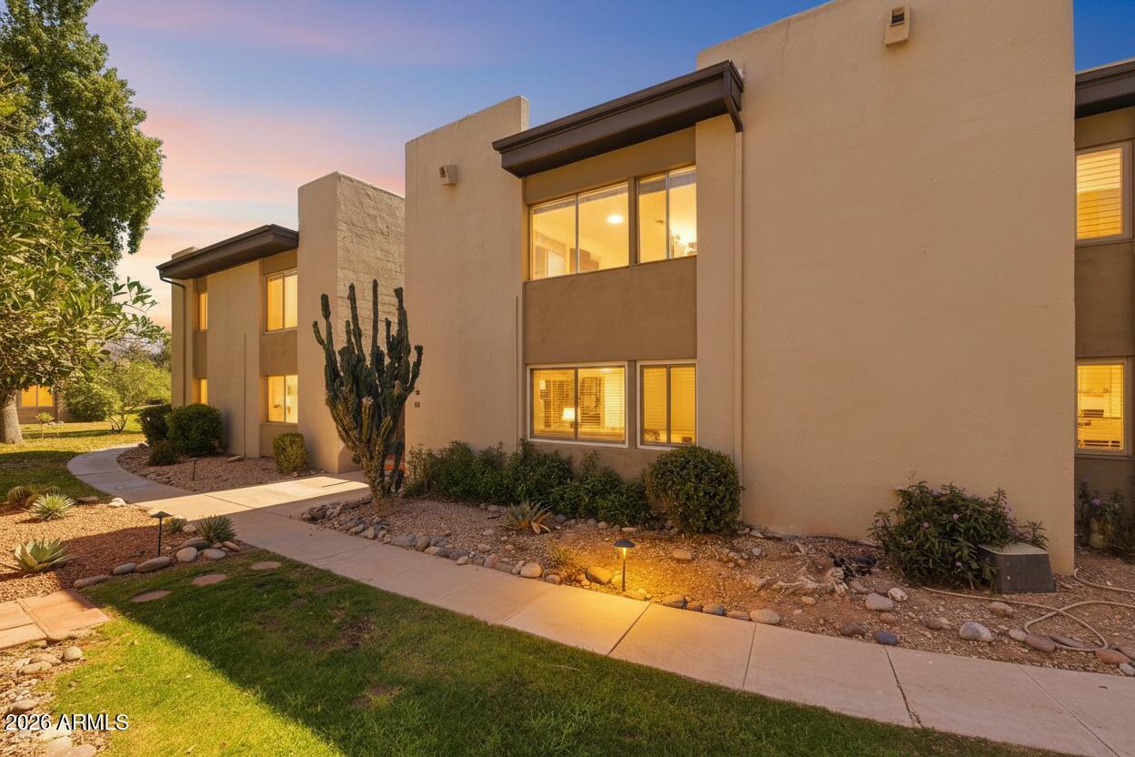 4201 East Camelback Road, Unit 34 Phoenix, AZ 85018 - Photo 2 of 19 a front view of a house with garden