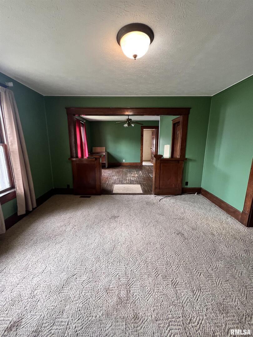 202 Wilson Street Anna, IL 62906 - Photo 11 of 18 an empty room with furniture and a window