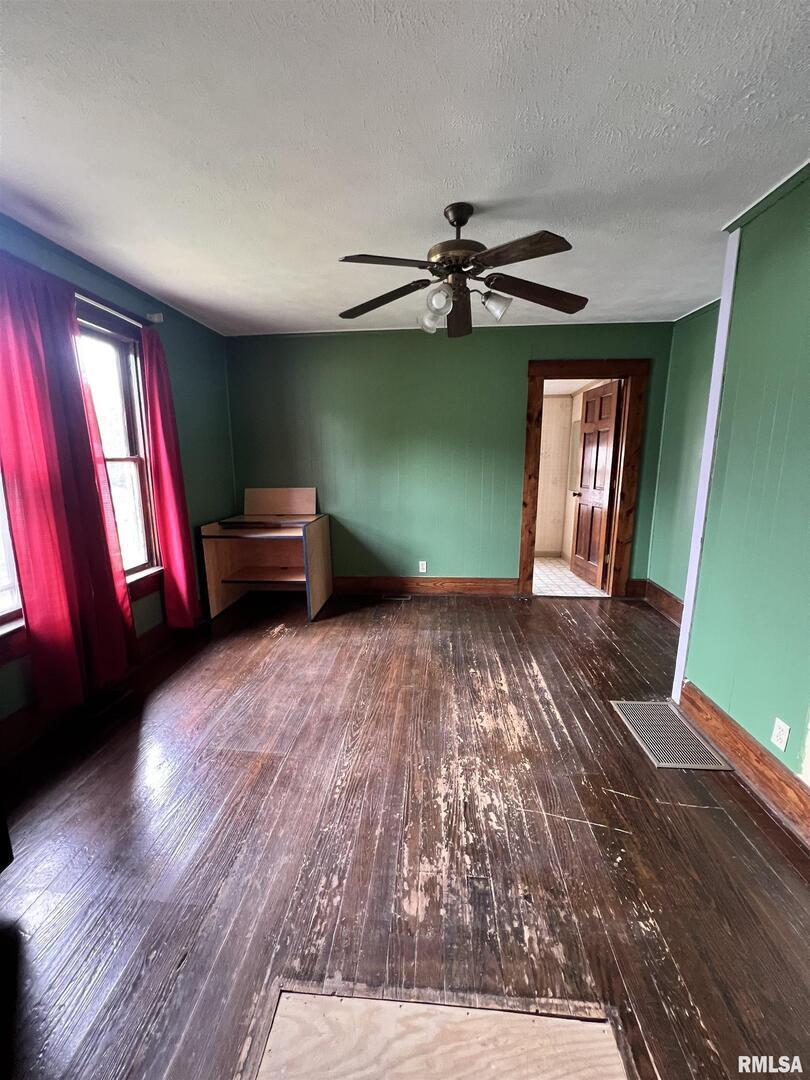 202 Wilson Street Anna, IL 62906 - Photo 10 of 18 a furnished livingroom with window and hardwood floor