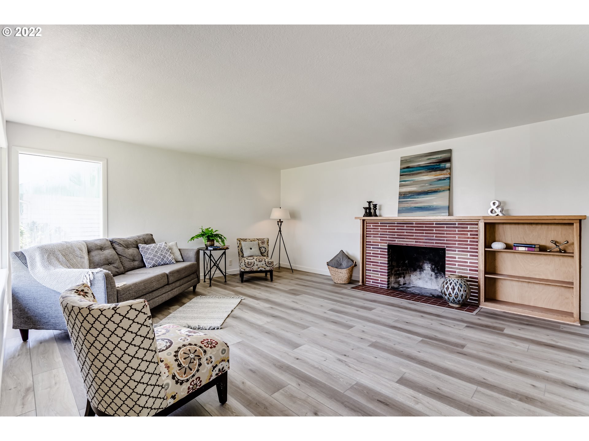 2866 Manor Drive Springfield, OR 97477 - Photo 5 of 32 a living room with furniture and a fireplace