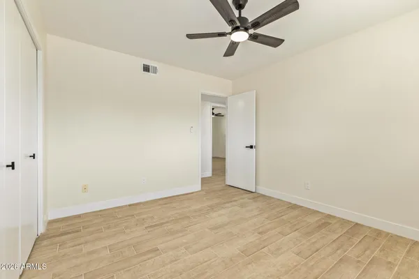 an empty room with fan