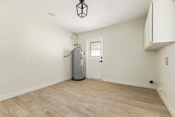 a view of an empty room with a window