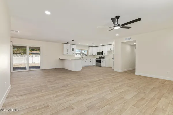 a view of a kitchen with a sink and a window