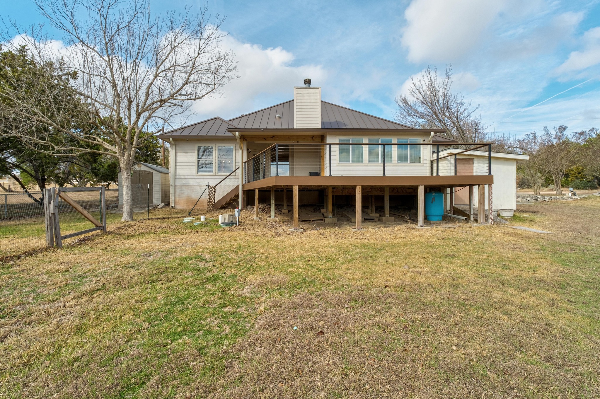 1021 Westland Ridge Road Dripping Springs, TX 78620 - Photo 24 of 33 Expansive deck and two storage sheds