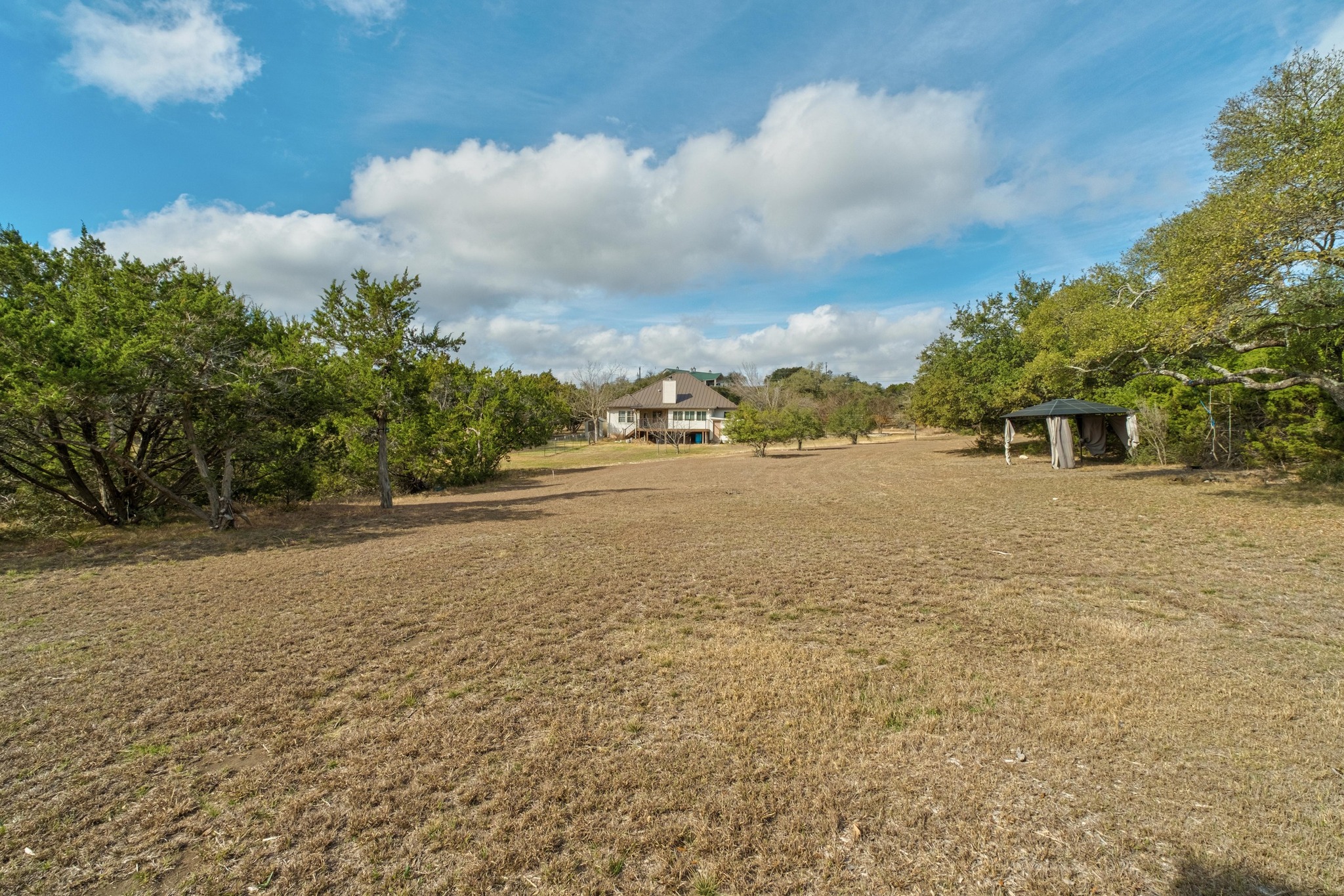 1021 Westland Ridge Road Dripping Springs, TX 78620 - Photo 5 of 33 Back yard looking to the house