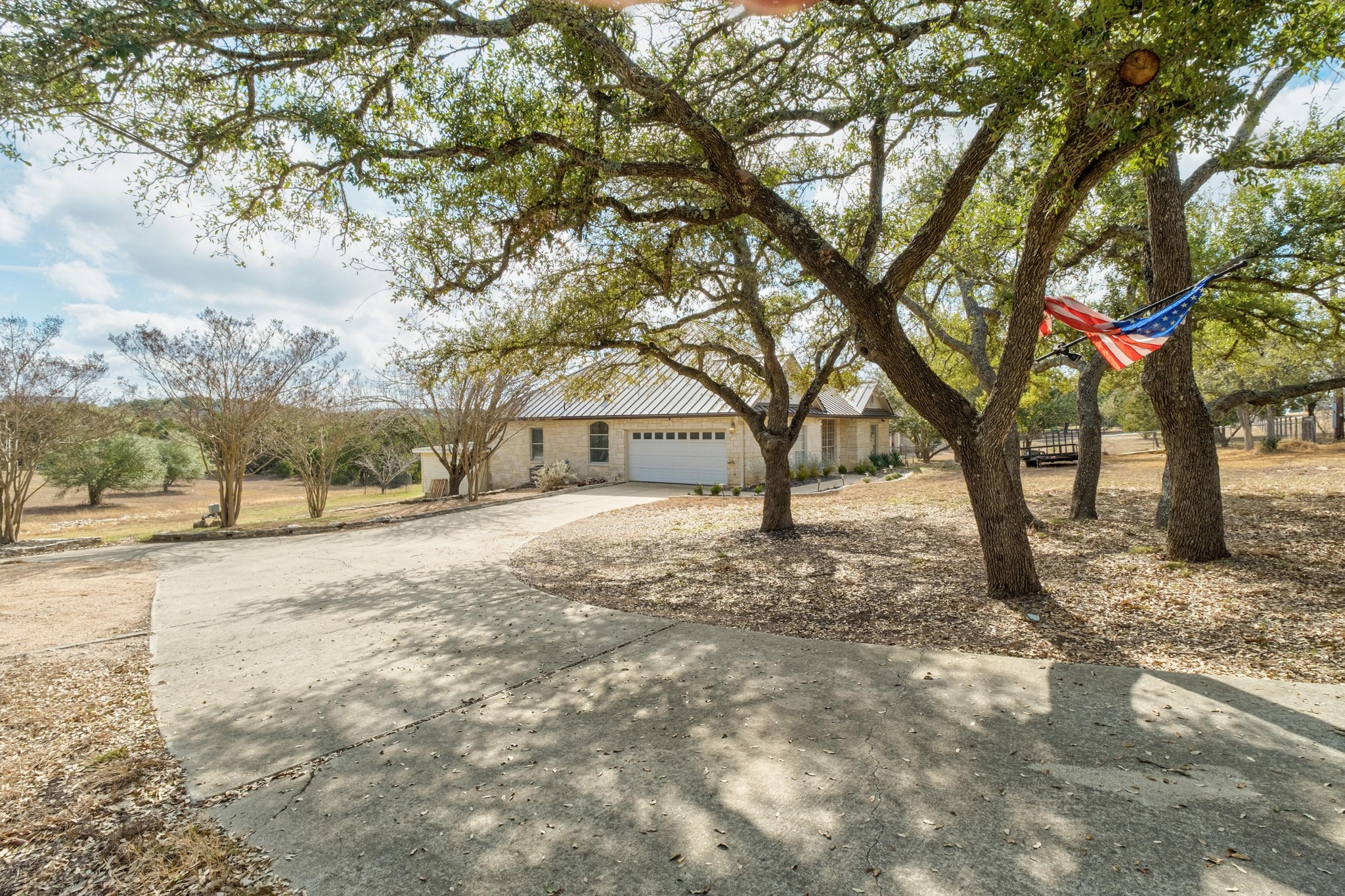 1021 Westland Ridge Road Dripping Springs, TX 78620 - Photo 7 of 33 Lots of room for parking. The house is set back from the street