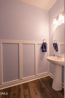 a bathroom with a sink and mirror