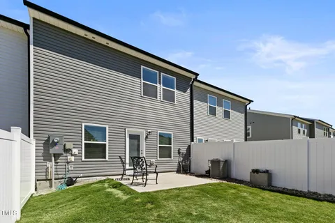 a front view of house with yard and outdoor seating