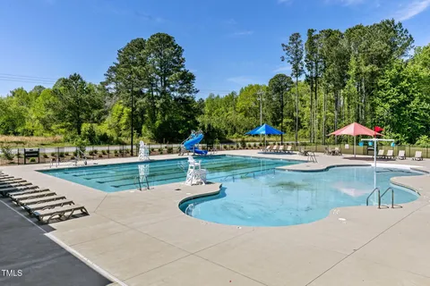 a view of a swimming pool with an outdoor space and seating area