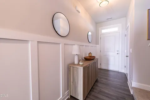 a kitchen with stainless steel appliances granite countertop a stove and a wooden floor