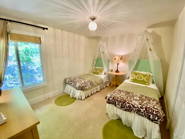 a spacious bedroom with a bed and a couch