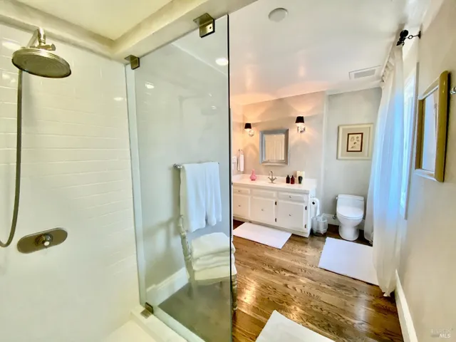 a kitchen that has a lot of cabinets a sink and appliances in it