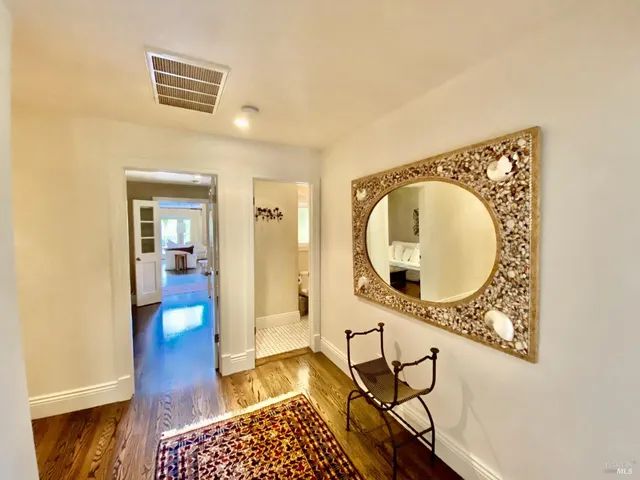 a bedroom with furniture and a flat screen tv