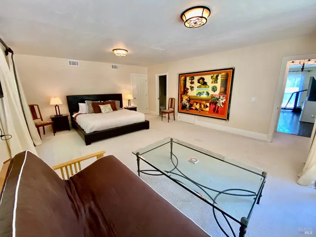 a view of a patio with table and chairs and potted plants