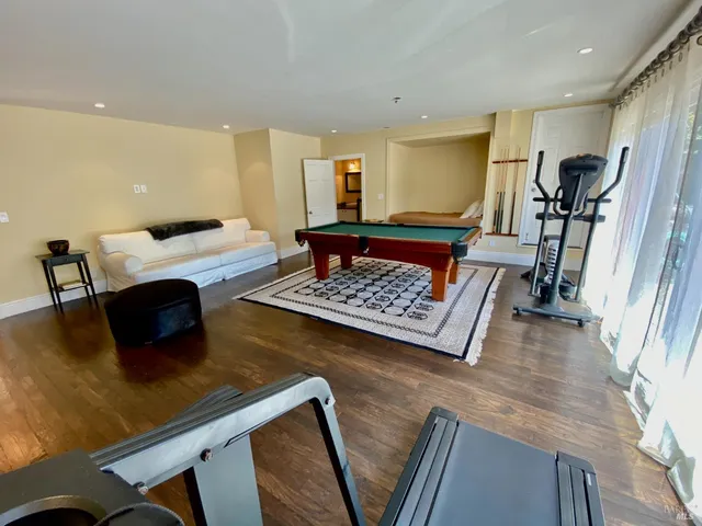 a view of a backyard with potted plants