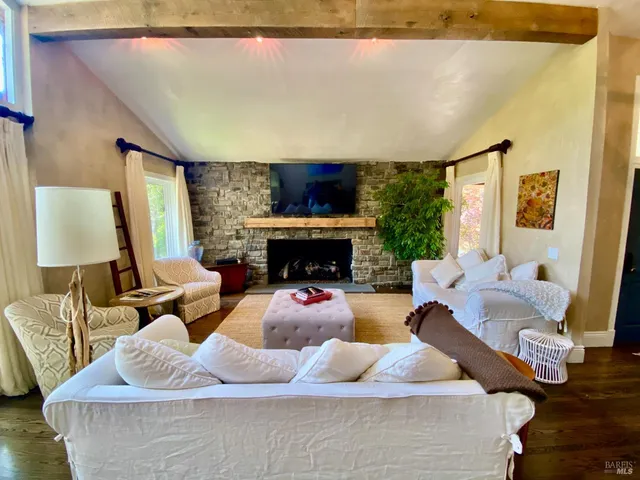 a living room with furniture and a rug