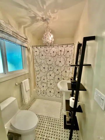 a bed room with a bed and a window