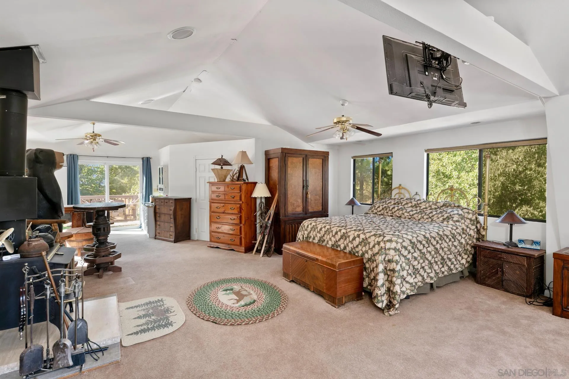 8203 Morris Ranch Road Pine Valley, CA 91962 - Photo 18 of 42 a spacious bedroom with a bed mirror and window